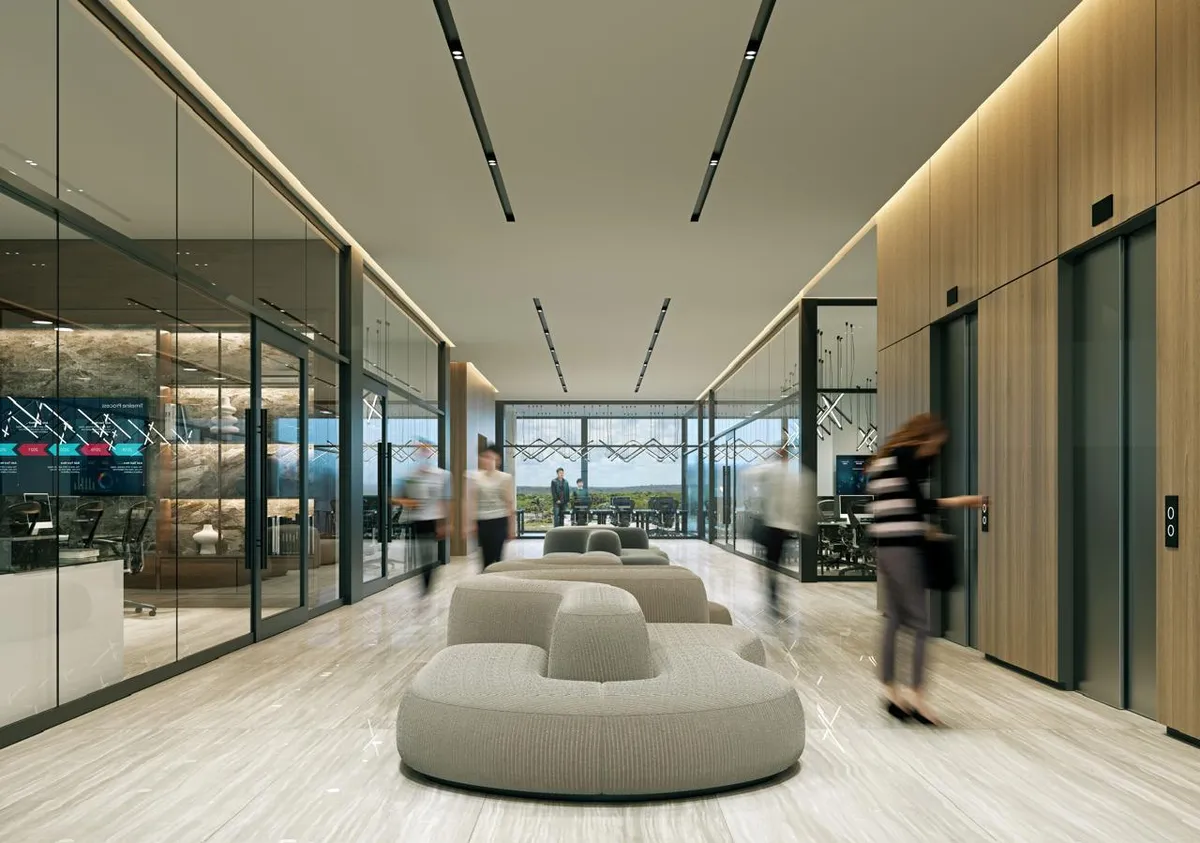Rendering of an office corridor with glass-walled offices, lounge seating, linear ceiling lights and elevators